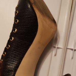 Navy nine west pumps with gold grommets